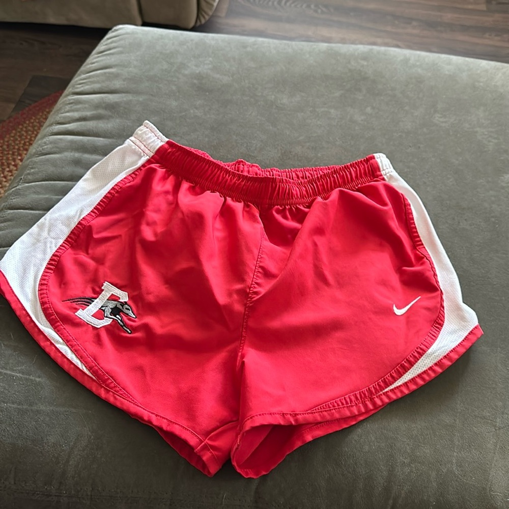 Women’s red, Nike running shorts